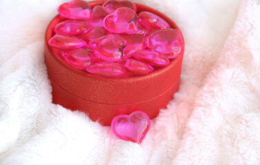 Red gift box and crystal hearts. Copy space. Holiday banner, web poster, flyer,  greeting card, cover. Beautiful romantic  background for Valentines Day.