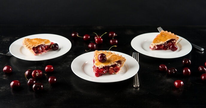High angle view of cherry pie served in plate on table