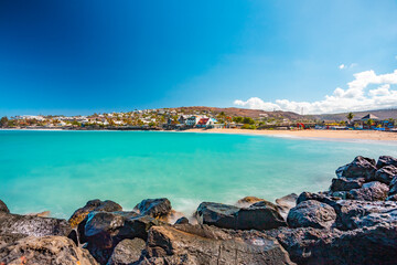 Fototapeta na wymiar Touristic site of Roches Noires Beach at saint-Gilles-les-bains - Reunion Island - long exposure