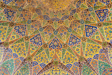 Colorful ceiling kashi-kari or faience tile mosaic decoration on ancient mughal era tomb of Asif Khan in Lahore, Punjab, Pakistan