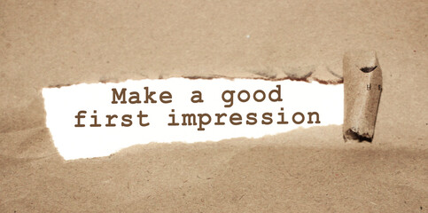 The text Make a good first impression appearing behind torn brown paper