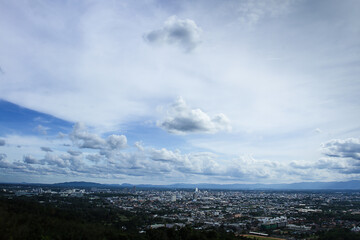 Fluffy clouds in the sky over a city