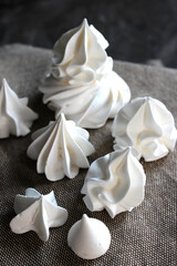 White meringues on a linen towel
