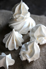 Fototapeta na wymiar White meringues on a linen towel