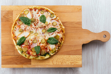 italian oven pizza with mazzarella, tomatoes and basil