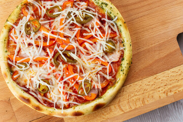 italian oven pizza with mazzarella, tomatoes and basil