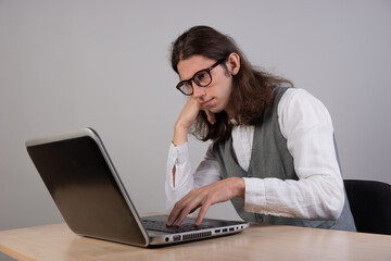 geek guy is trying to write code or learn a new programming language, experience difficulties in...