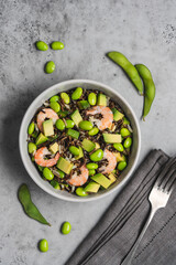 Shrimp salad with black rice, edamame beans, avocado. Healthy nutrition with seafood 