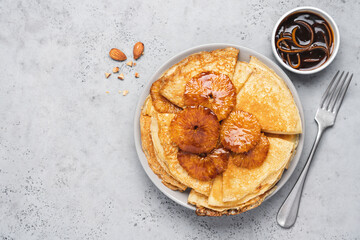 Traditional French thin pancakes crêpe suzette with orange sauce. Morning breakfast dessert