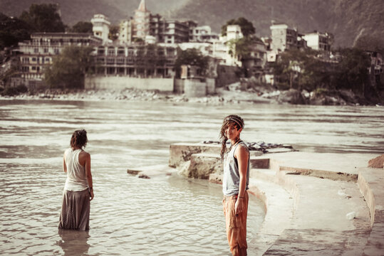 Portrait of smiling woman standing by river