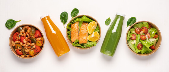 Paper containers with healthy takeaway food. Salmon, lettuce and bell peppers with beans. Bottled...