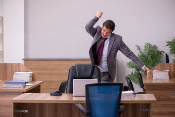 Young businessman employee in bullying concept in the office