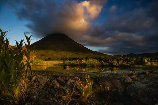 The landscape of volcan Arenal during sunset, as seen from the lake Arenal area, Costa Rica.