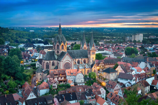 Heppenheim, Germany. Aerial cityscape at dusk with St. Peter church on foreground