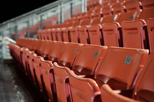 Empty seats in American football stadium at night