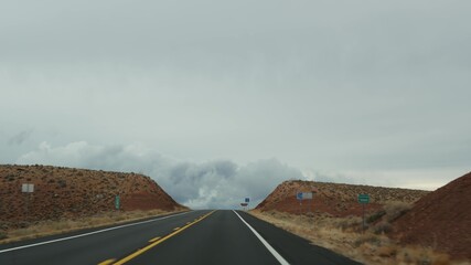 Road trip to Grand Canyon, Arizona USA, driving auto from Utah. Route 89. Hitchhiking traveling in America, local journey, wild west calm atmosphere of indian lands. Highway view thru car windshield.
