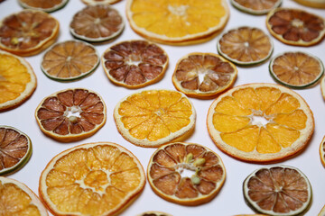 Fototapeta na wymiar Dried fruit on colored background. Pattern of a fruit frips. Healthy eating