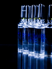 Ampoules on a black background.