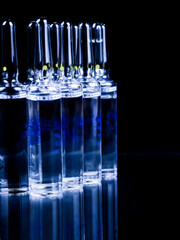 Ampoules on a black background.