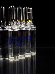 Ampoules on a black background.
