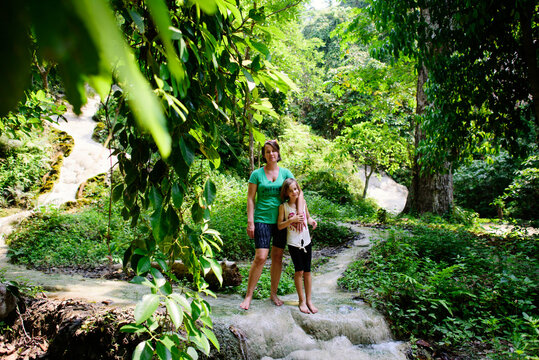 Mother and daughter standing at Bua Thong Waterfalls