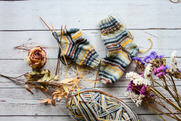 Colorful socks on vintage wooden background