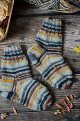 Fototapeta na wymiar Colorful socks on vintage wooden background