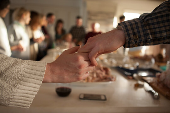 Close-up of holding hands while praying