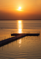 Obraz premium pontoon pier at beautiful summer sunset