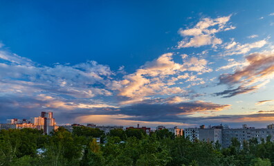 Fototapeta premium Sunset over the city in summer