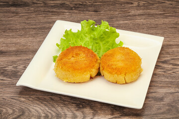 Vegan cuisine - Potato cutlet in the plate
