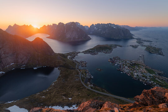 Evening May Sunlight over village of Rene and fjord mountain landscape from summit of Reinebringen, Moskenes&oslash;y, Lofoten Islands, Norway