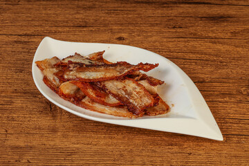 Roasted juicy bacon in the plate