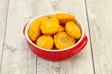 Marinated yellow patisson in the bowl