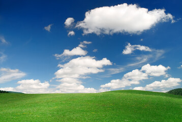 Idyllic view, green hills and blue sky