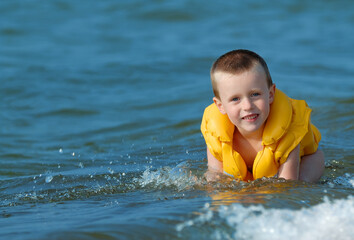 Fototapeta na wymiar Boy playing in the sea