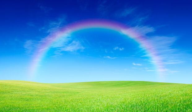 Idyllic view, rainbow over green field