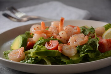 Avocado salad with shrimps and cherry tomatoes. Seafood breakfast