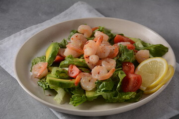 Avocado salad with shrimps and cherry tomatoes. Seafood breakfast