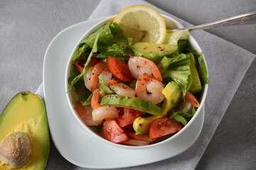 Avocado salad with shrimps and cherry tomatoes. Seafood breakfast