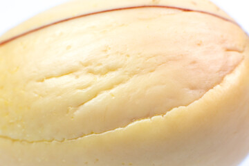 Natural wooden texture of bone avocado. Beige eco background. Close up.