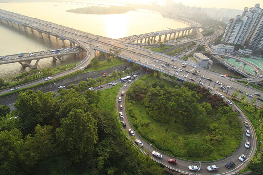 Aerial view of cars moving on Mapo Bridge over Han River during sunset