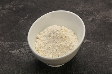 Wheat flour heap in the bowl