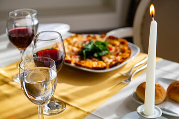 Delicious pizza served on white table.