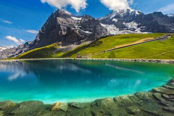 Clean blue mountain lake in the Swiss Alps, Bernese Oberland - obrazy, fototapety, plakaty