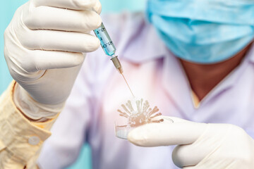 An expert is doing a test for a vaccine to prevent disease in a sterile tray.