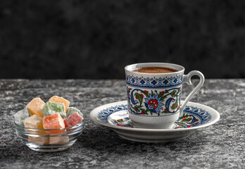 Turkish Coffee with traditional porcelain cup. Coffee presentation with Turkish delight. Sparkling Turkish Coffee..