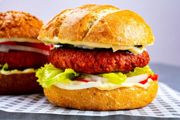 Tasty hamburger made with vegetarian plant based imitation minced meat burger and fresh vegetables