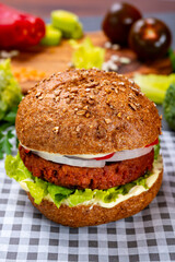 Tasty hamburger made with vegetarian plant based imitation minced meat burger and fresh vegetables