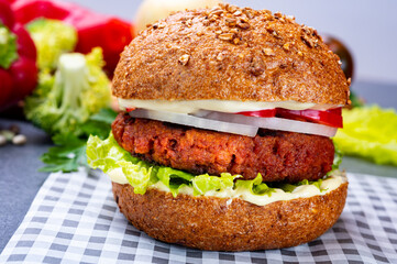 Tasty hamburger made with vegetarian plant based imitation minced meat burger and fresh vegetables